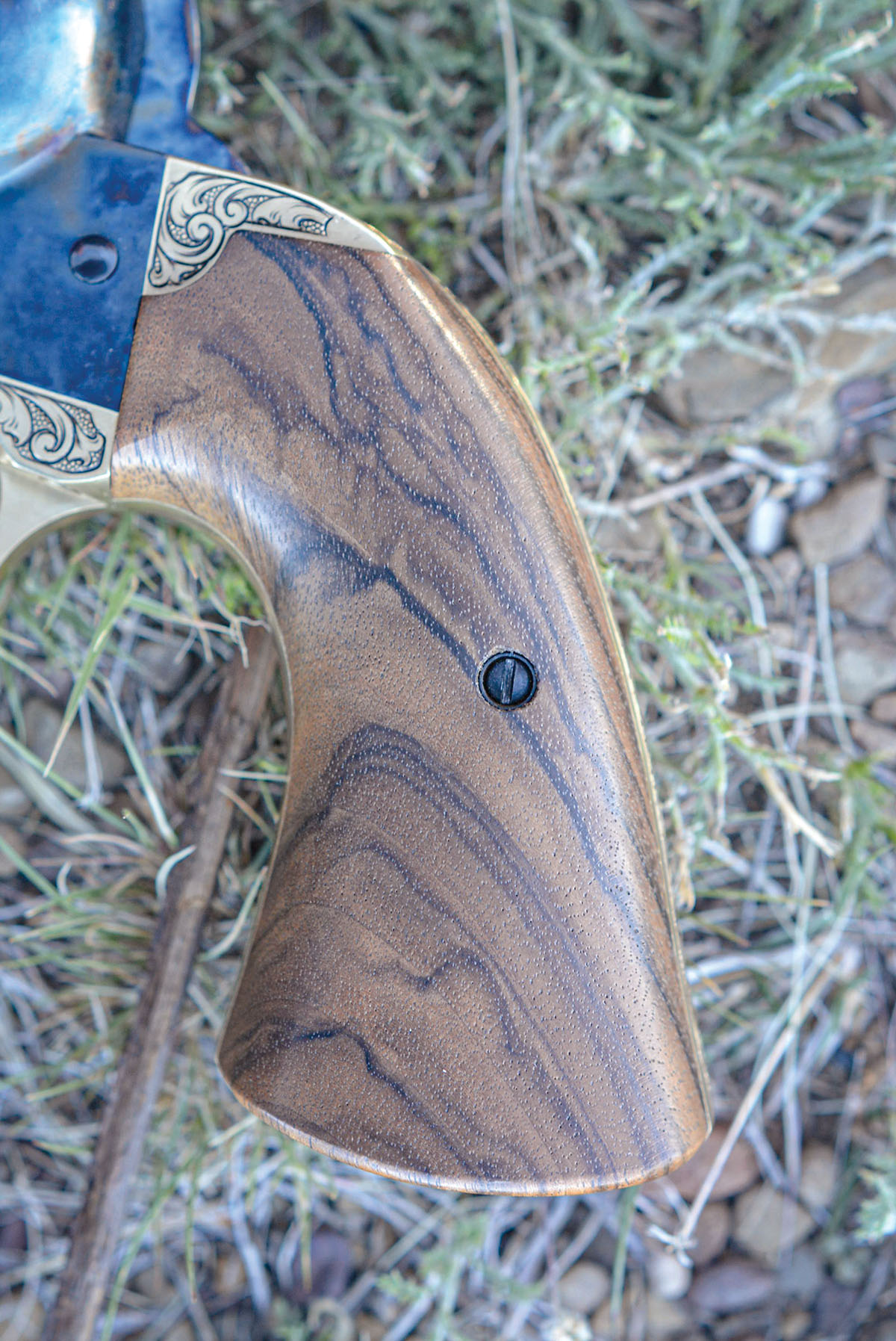 Stocks (aka grips) are constructed of fancy walnut.